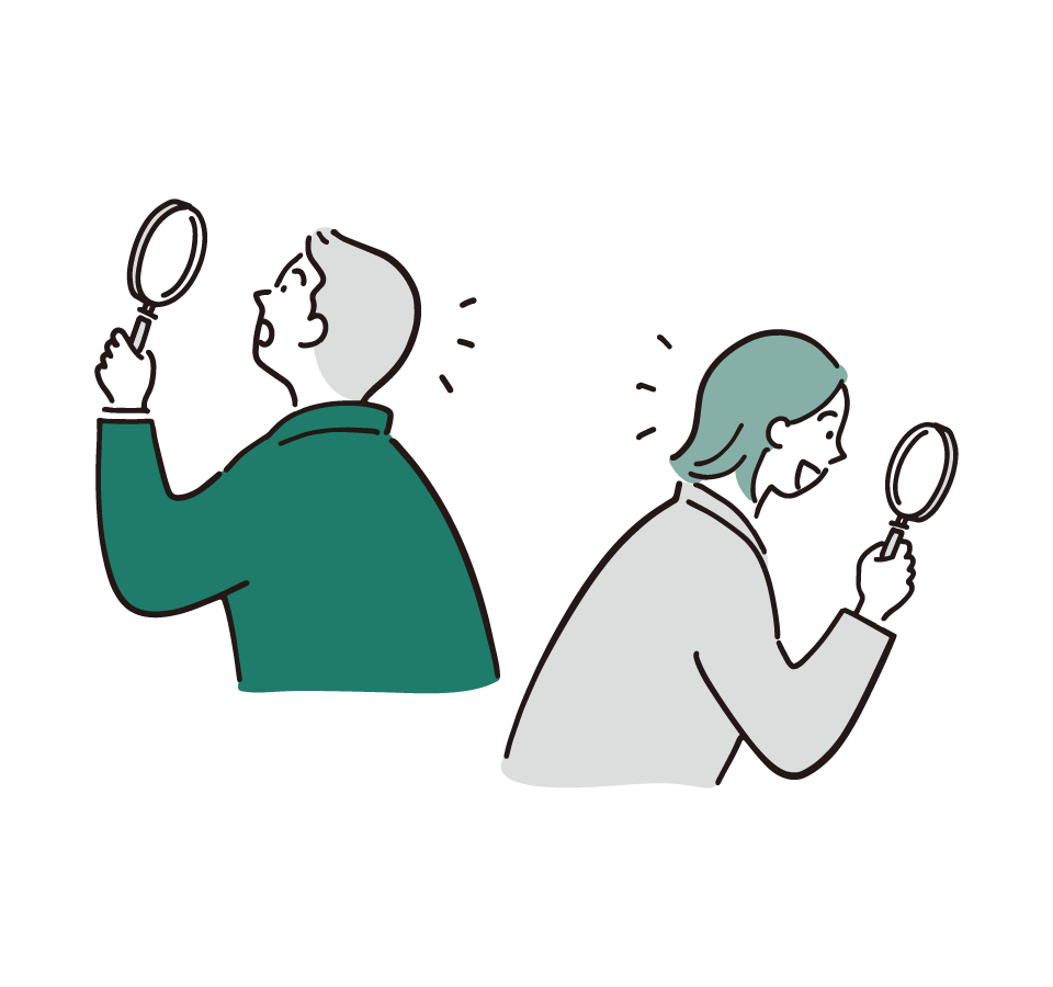 Two people holding magnifying glasses, leaning forward as if inspecting something together.